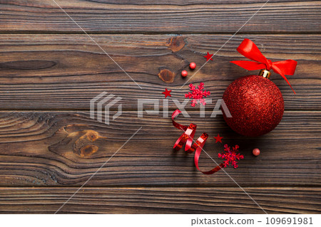 Christmas ball on colored background. decoration bauble with ribbon bow with copy space 109691981