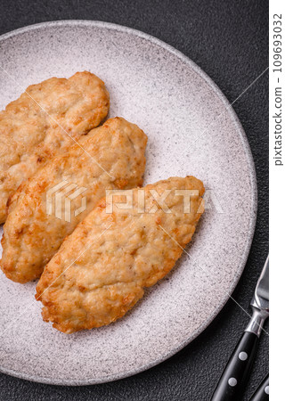 Delicious fresh fried minced fish or chicken cutlets with spices and herbs 109693032