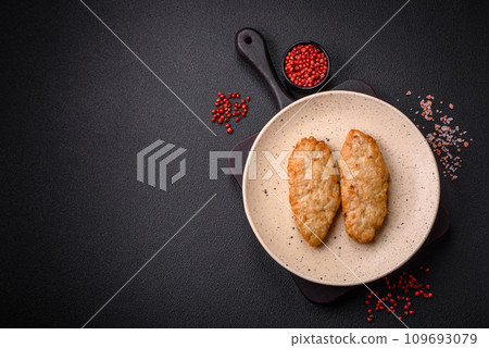Delicious fresh fried minced fish or chicken cutlets with spices and herbs 109693079