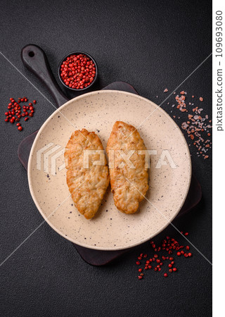 Delicious fresh fried minced fish or chicken cutlets with spices and herbs 109693080