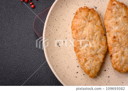 Delicious fresh fried minced fish or chicken cutlets with spices and herbs Delicious fresh fried minced fish or chicken cutlets with spices and herbs 109693082