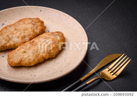 Delicious fresh fried minced fish or chicken cutlets with spices and herbs 109693092
