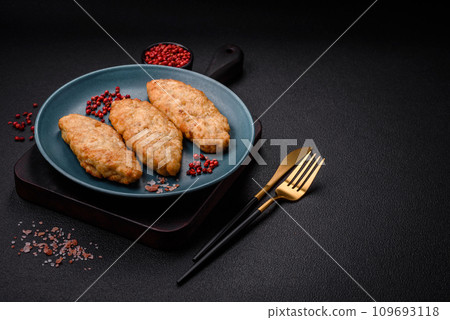 Delicious fresh fried minced fish or chicken cutlets with spices and herbs 109693118