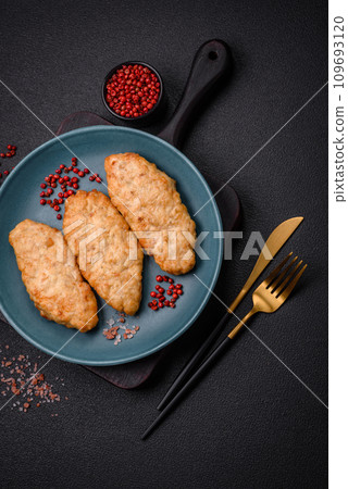 Delicious fresh fried minced fish or chicken cutlets with spices and herbs Delicious fresh fried minced fish or chicken cutlets with spices and herbs 109693120