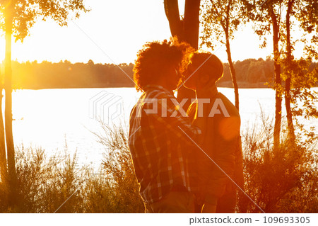 Golden Hour Embrace: Love Illuminated by Sunset 109693305