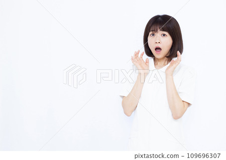 Surprised female nurse in her 30s Surprised female nurse in her 30s 109696307