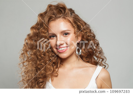 Happy redhead model woman with long healthy wavy hairstyle, perfect clean fresh skin  109697283