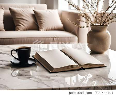 View at marble table with note and coffee in minimalist beige modern home interior View at marble table with note and coffee in minimalist beige modern home interior 109698494