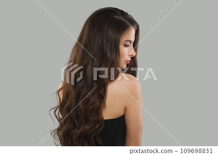 Charming young female model woman with long healthy dark brown hair, shiny fresh skin. Charming young female model woman with long healthy dark brown hair, shiny fresh skin. 109698831