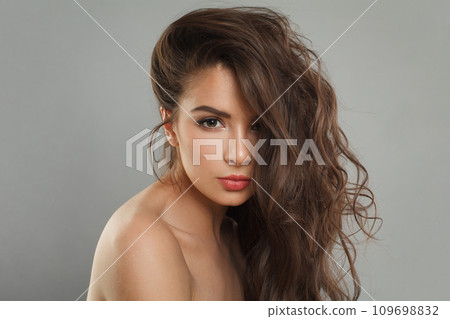 Nice young female model woman with long healthy dark brown hair, shiny fresh skin. Nice young female model woman with long healthy dark brown hair, shiny fresh skin. 109698832