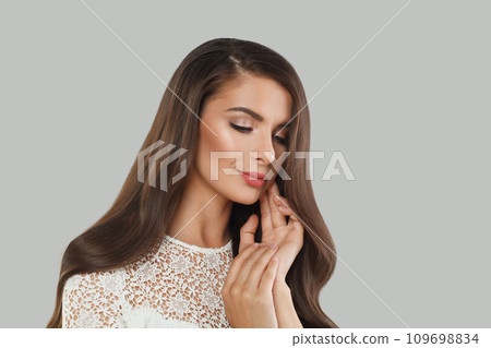 Pretty young female model woman with long healthy dark brown hair, shiny fresh skin. Pretty young female model woman with long healthy dark brown hair, shiny fresh skin. 109698834