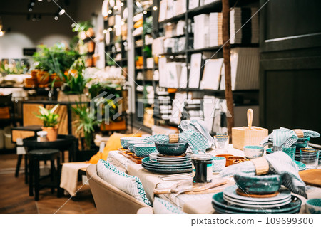 View of assortment of decor for interior shop in store of shopping center. Home accessories and household products for dining room in store of shopping centre. Home accessories of dinnerware on table View of assortment of decor for interior shop in store of shopping center. Home accessories and household products for dining room in store of shopping centre. Home accessories of dinnerware on table 109699300