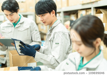 Young man packing products in the backyard Young man packing products in the backyard 109699846