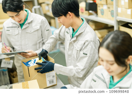 Young man packing products in the backyard Young man packing products in the backyard 109699848