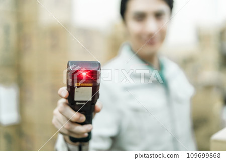 A male manager manages warehouse entry and exit on a terminal A male manager manages warehouse entry and exit on a terminal 109699868