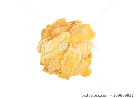 Dried mango fruit pieces isolated on white background. 109699921