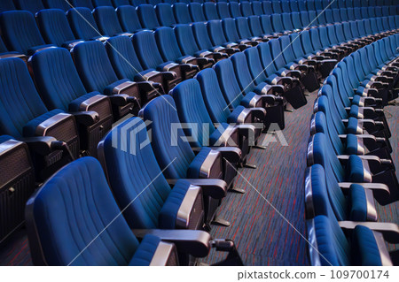 High angle view of blue folded bleachers in empty auditorium in conference hall High angle view of blue folded bleachers in empty auditorium in conference hall 109700174