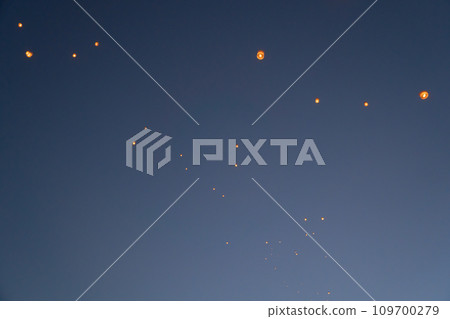 Thai people release sky floating lanterns or lamp to worship Buddha's relics at night. Traditional festival in Chiang mai, Thailand. Loy krathong Thai people release sky floating lanterns or lamp to worship Buddha's relics at night. Traditional festival in Chiang mai, Thailand. Loy krathong 109700279