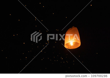 Thai people release sky floating lanterns or lamp to worship Buddha's relics at night. Traditional festival in Chiang mai, Thailand. Loy krathong Thai people release sky floating lanterns or lamp to worship Buddha's relics at night. Traditional festival in Chiang mai, Thailand. Loy krathong 109700286