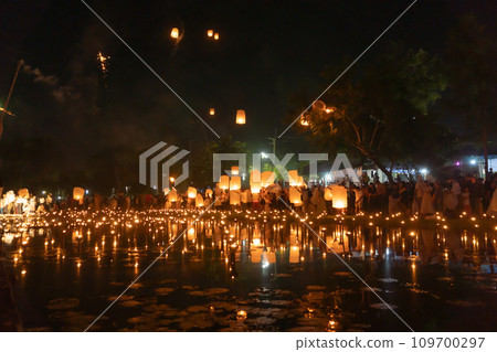 Thai people release sky floating lanterns or lamp to worship Buddha's relics at night. Traditional festival in Chiang mai, Thailand. Loy krathong Thai people release sky floating lanterns or lamp to worship Buddha's relics at night. Traditional festival in Chiang mai, Thailand. Loy krathong 109700297
