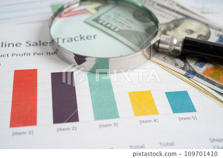 Magnifying glass on graph paper. Financial development, Banking Account, Statistics, Investment Analytic research data economy, Business concept. Magnifying glass on graph paper. Financial development, Banking Account, Statistics, Investment Analytic research data economy, Business concept. 109701410