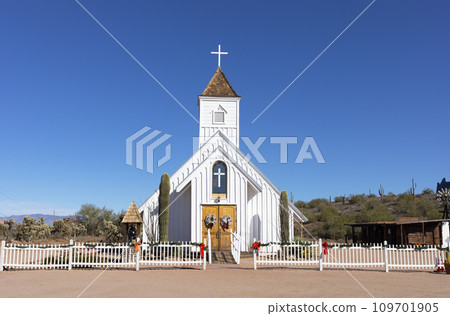 Old Elvis Chapel, Church From Arizona's Mining Days in Superstition Mountains, Near Phoenix, Apache Junction, Ghost Town of Goldfield. Blue Sky, Cactus. Horizontal Plane Old Elvis Chapel, Church From Arizona's Mining Days in Superstition Mountains, Near Phoenix, Apache Junction, Ghost Town of Goldfield. Blue Sky, Cactus. Horizontal Plane 109701905