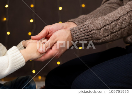 Dad and son hands, father and child holding hands at Christmas. 109701955