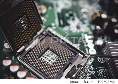 Comptuer processor and motherboard, microchip details close view. Hi-tech innovation background Comptuer processor and motherboard, microchip details close view. Hi-tech innovation background 109702700