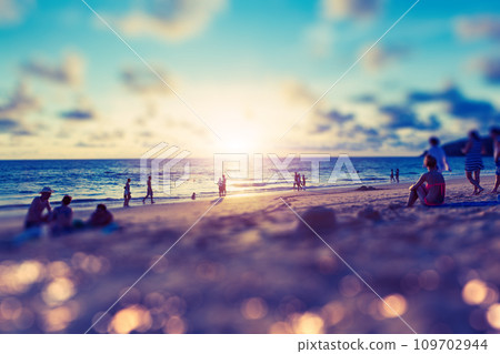 Beach party and sunset scenery. 109702944