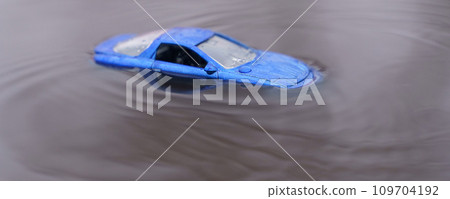 The car was flooded by floods. One of them is out of focus. The car was flooded by floods. One of them is out of focus. 109704192
