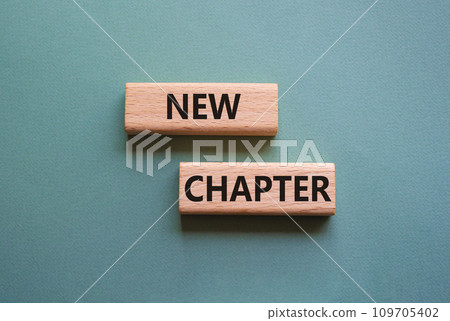New Chapter symbol. Concept word New Chapter on wooden blocks. Beautiful grey green background. Business and New Chapter concept. Copy space New Chapter symbol. Concept word New Chapter on wooden blocks. Beautiful grey green background. Business and New Chapter concept. Copy space 109705402