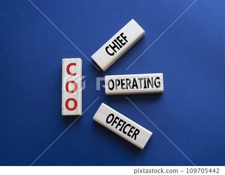 COO - Chief Operating Officer symbol. Concept word COO on wooden blocks. Beautiful deep blue background. Business and COO concept. Copy space. 109705442