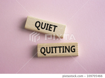 Quiet quitting symbol. Concept word Quiet quitting on wooden blocks. Beautiful pink background. Business and Quiet quitting concept. Copy space. 109705466