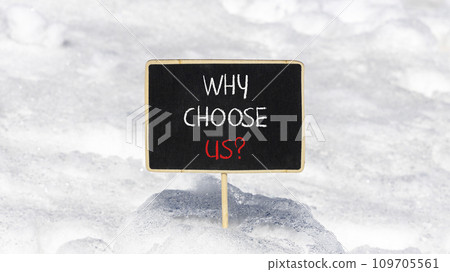Why choose us symbol. Concept word Why choose us on beautiful wooden black chalk blackboard. White snow. Beautiful white snow background. Business motivational why choose us concept. Copy space. 109705561