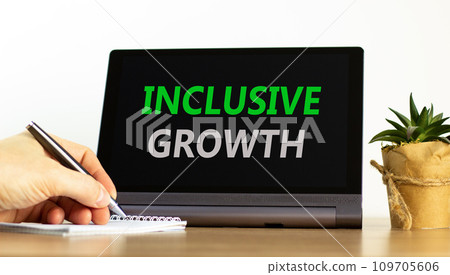 Inclusive growth symbol. Concept words Inclusive growth on beautiful black tablet. Beautiful white background. Businessman hand. Business inclusive growth concept. Copy space. Inclusive growth symbol. Concept words Inclusive growth on beautiful black tablet. Beautiful white background. Businessman hand. Business inclusive growth concept. Copy space. 109705606