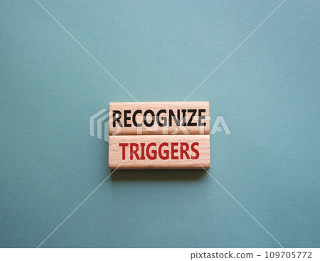 Recognize triggers symbol. Concept words Recognize triggers on wooden blocks. Beautiful grey green background. Business and Recognize triggers concept. Copy space. 109705772