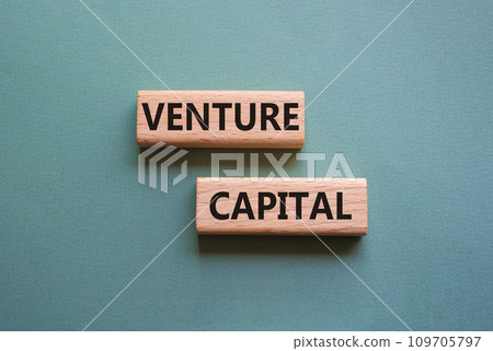 Venture capital symbol. Wooden blocks with words Venture capital. Beautiful grey green background. Business and Venture capital concept. Copy space. 109705797