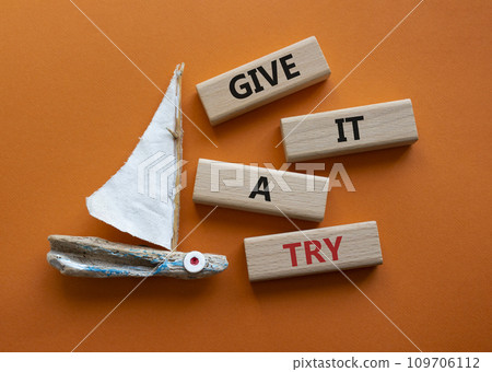 Give it a try symbol. Concept words Give it a try on wooden blocks. Beautiful orange background with boat. Business and Give it a try concept. Copy space. Give it a try symbol. Concept words Give it a try on wooden blocks. Beautiful orange background with boat. Business and Give it a try concept. Copy space. 109706112