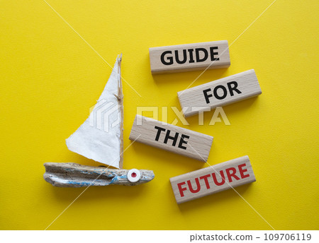 Guide for the future symbol. Wooden blocks with words Guide for the future. Beautiful yellow background with boat. Business and Guide for the future concept. Copy space. Guide for the future symbol. Wooden blocks with words Guide for the future. Beautiful yellow background with boat. Business and Guide for the future concept. Copy space. 109706119