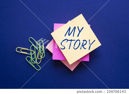 My story symbol. Orange steaky note with words My story. Beautiful deep blue background. Business and My story concept. Copy space. 109706143