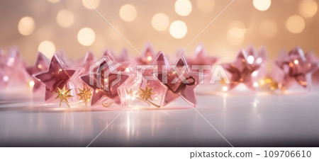 gold star shaped stars over white background with light shining through, gold star shaped stars over white background with light shining through, 109706610