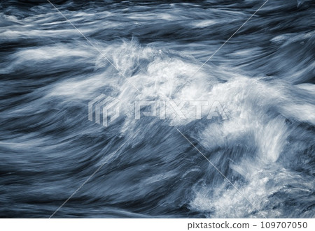 dramatic detail of the raging waves of the blue river dramatic detail of the raging waves of the blue river 109707050