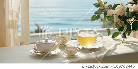 a glass of tea with breakfast on the table a glass of tea with breakfast on the table 109708440