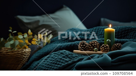 a bed is covered with blankets and candles a bed is covered with blankets and candles 109708564