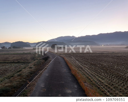 Asuka Village at dawn with fog in the air Asuka Village at dawn with fog in the air 109709351