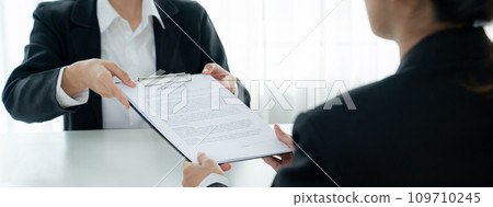 Business executive signing contract agreement document. Shrewd 109710245