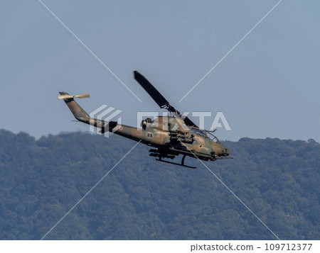 Anti-tank helicopter AH-1S Cobra flying over Yao Garrison Anti-tank helicopter AH-1S Cobra flying over Yao Garrison 109712377