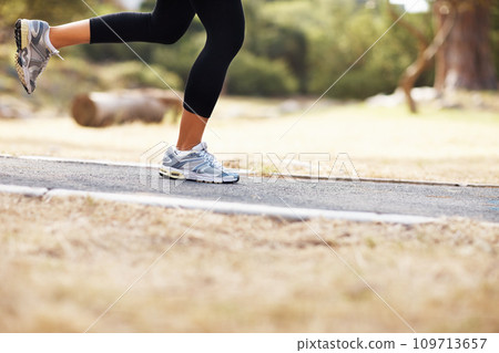 Running, wellness and shoes of woman in nature for fitness, speed and cardio challenge. Health, sports and workout with female runner training in outdoor path for exercise, fast and performance 109713657