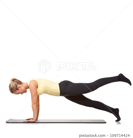 Woman, plank and mat in studio for stretching, pilates or workout for healthy body, wellness or core muscle. Person, exercise or yoga on floor for abdomen health on mockup space or white background 109714424