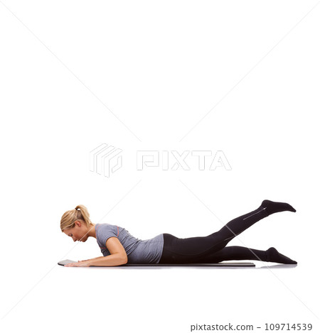 Woman, fitness and mat in studio for cobra, pilates or workout for healthy body, wellness and core muscle. Person, exercise and yoga on floor for abdomen health on mockup space and white background 109714539